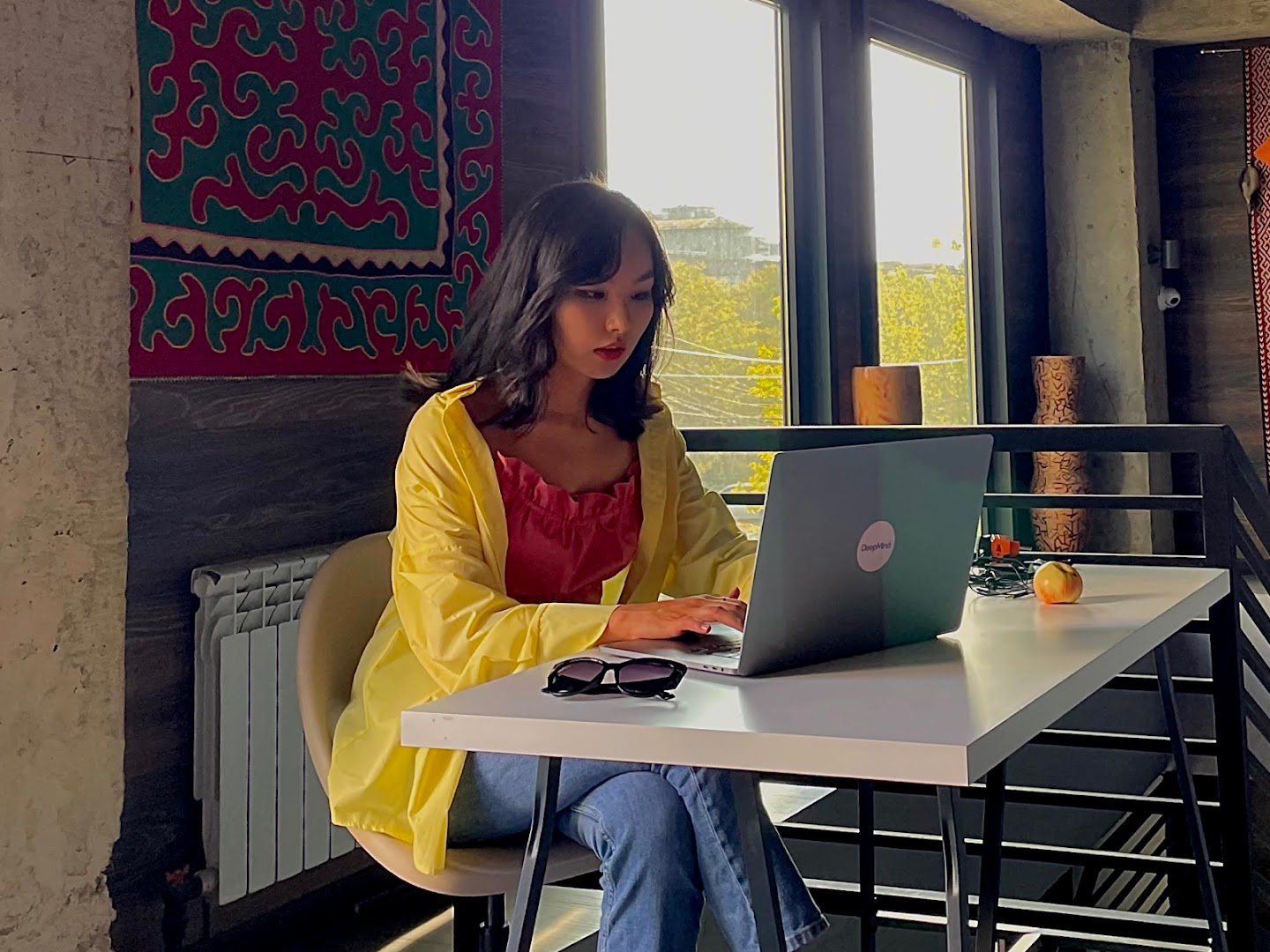 Aliya Rysbek working on a laptop.