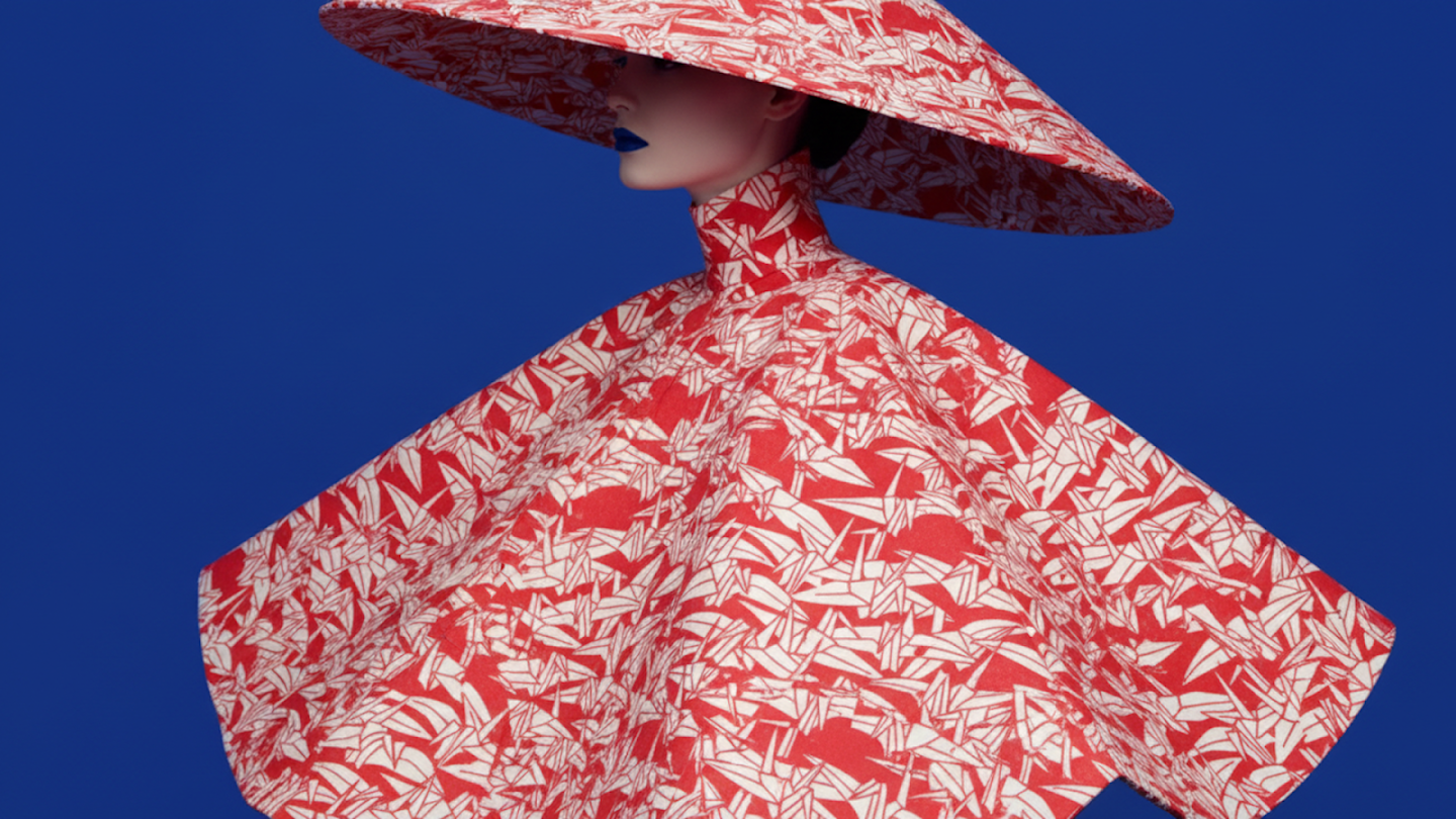  AI-generated image of: Fashion portrait with a person in a voluminous red and white patterned garment and wide-brimmed hat, set against a solid royal blue background. The pattern appears to be stylized origami cranes, and the person wears blue lipstick.