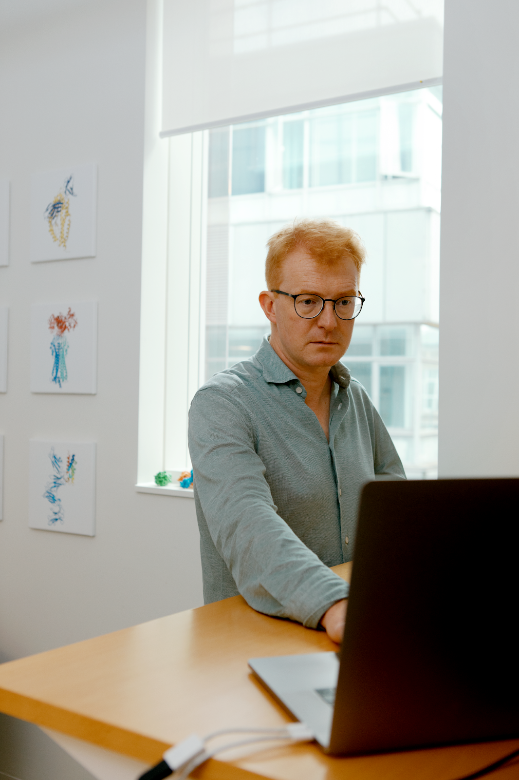 Professor Matthew Higgins photographed while using his computer.