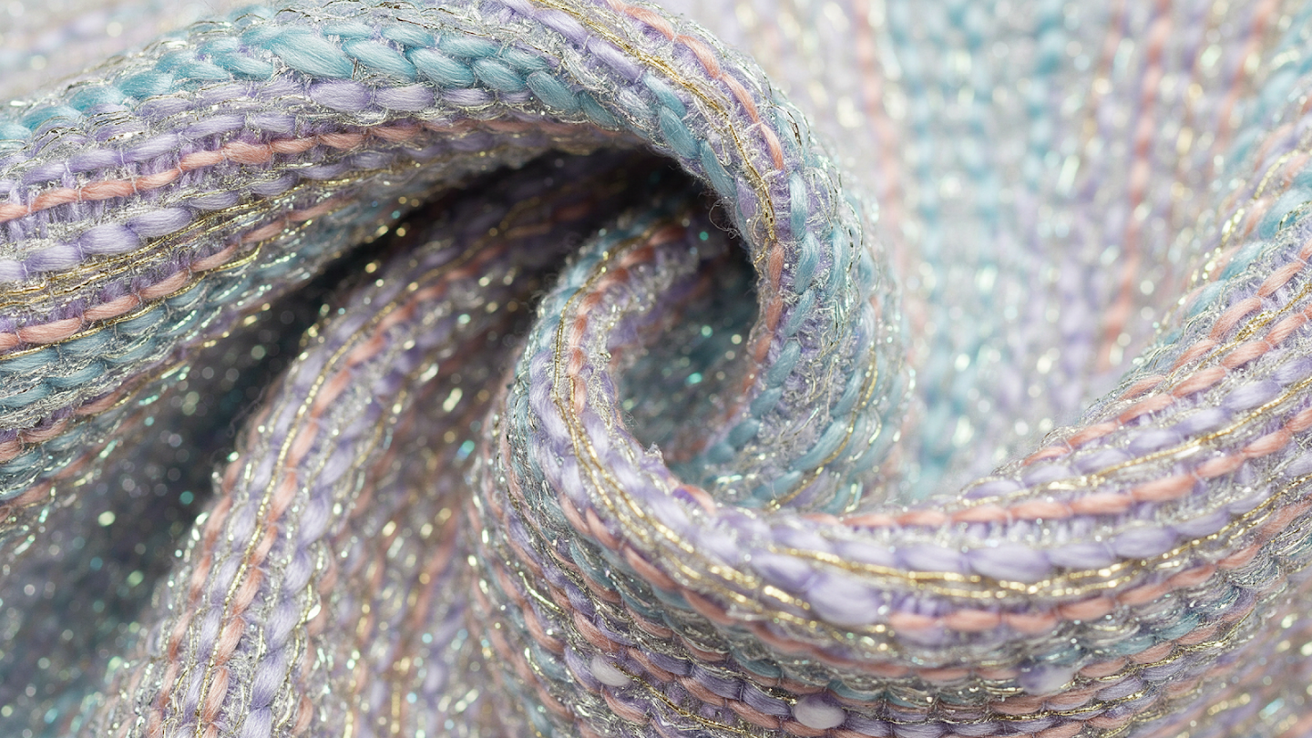 AI-generated image of: macro shot of a richly textured woven fabric, combining thick, soft pastel yarns in blue and pink with thin, glittering metallic gold threads interlaced throughout